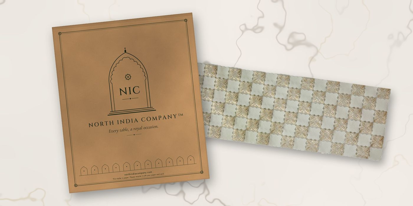 Kraft paper mailer beside a Sheesh Mahal table runner